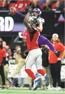  ?? Scott Cunningham / Getty Images ?? The Vikings’ Andrew Sendejo (34) breaks up a pass intended for the Falcons’ Julio Jones in the second half.