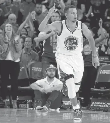  ?? BEN MARGOT/ASSOCIATED PRESS ?? Golden State Warriors' Stephen Curry gestures after scoring against the Portland Trail Blazers during the first half of a preseason NBA basketball game Friday in Oakland.