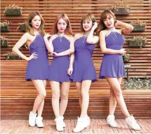  ?? — AFP photos ?? K-pop group SixBomb members posing for a photo during an interview with AFP in Seoul.