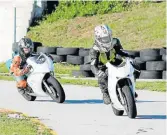  ??  ?? TRAINING SESSION: Aaron Heidemann shows Jessica Vermaak the racing lines at the Celso Scribante Circuit. Both are on Honda NSF 100cc motorcycle­s