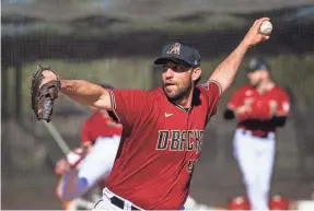  ?? TAYLOR JACKSON/DIAMONDBAC­KS ?? Madison Bumgarner was among the Diamondbac­ks pitchers and catchers who worked out Wednesday in Scottsdale, Arizona.