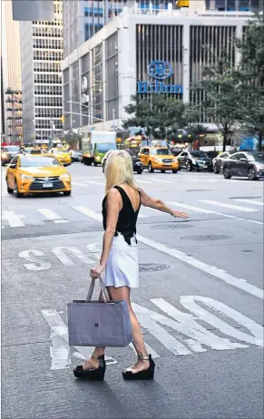  ?? [ Getty Images ] ?? Gelbe Taxis prägen New Yorks Stadtbild. Doch Uber setzt ihnen zu.