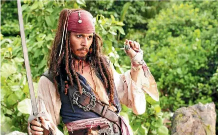  ?? WALT DISNEY PICTURES ?? The Pirates of the Caribbean movies have helped Johnny Depp earn an estimated US$650 million over the course of his career – and it’s almost all gone. Depp is battling his former business managers over his dwindling fortune, but says it is ‘‘insulting’’ to claim that he spent less than he actually did.