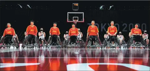  ?? PROVIDED TO CHINA DAILY ?? The Chinese national wheelchair basketball team celebrates winning at the 2018 Asia Para Games in Jakarta, Indonesia.