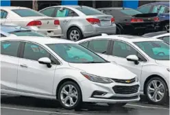  ?? ASSOCIATED PRESS FILE PHOTO ?? Chevrolet cars are on sale at a dealership lot in Pittsburgh.