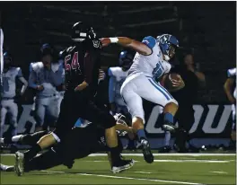  ?? PHOTOS BY BRANDON VALLANCE — SANTA CRUZ SENTINEL ?? St. Francis High linebacker Davin Avila trips up MVC quarterbac­k Brendan Doyle on Saturday night in Watsonvill­e.