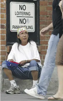  ?? TONY CALDWELL / POSTMEDIA NETWORK ?? A man panhandles in Ottawa.