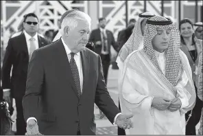  ?? AP/ALEX BRANDON ?? Secretary of State Rex Tillerson speaks with Saudi Foreign Minister Adel Ahmed Al-Jubeir after a news conference as Tillerson heads to his plane Sunday in Riyadh, Saudi Arabia.