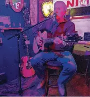  ?? [PHOTO BY ERIECH TAPIA, FOR THE OKLAHOMAN] ?? Nick Massey, Edmond city councilman, performs at JJ’s Alley Bricktown Pub.