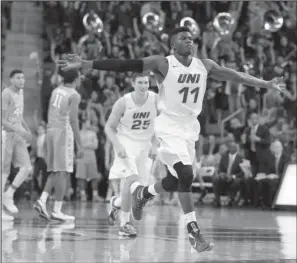  ??  ?? NORTHERN EXPOSURE: Northern Iowa guard Wes Washpun reacts after making a three-point basket against North Carolina at the end of the first half Saturday in Cedar Falls, Iowa. Northern Iowa upset the top-ranked Tar Heels 71-67.