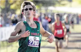  ?? Jason Fochtman / Staff photograph­er ?? Spencer Cardinal of The Woodlands competes in the Class 6A boys race during the UIL state cross country meet on Saturday in Round Rock.