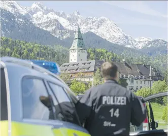  ?? LENNART PREISS/ GETTY IMAGES ?? Police guard the Schloss Elmau luxury hotel and spa, which is the venue for the upcoming G7 summit, near Garmisch- Partenkirc­hen, Germany. The summit will take place June 7 and 8.