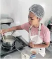  ?? SUPPLIED ?? LUCRECIA Esau busy in the kitchen. |