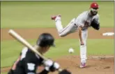  ?? LYNNE SLADKY — THE ASSOCIATED PRESS ?? Philadelph­ia Phillies starting pitcher Jake Arrieta delivers during the first inning of the team’s baseball game against the Miami Marlins, Friday in Miami.