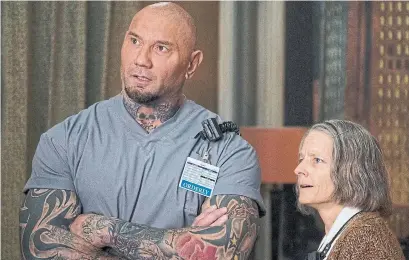  ?? MATT KENNEDY ?? Dave Bautista plays the strong-arm orderly to Jodie Foster’s excellent performanc­e as the Nurse in Drew Pearce’s Hotel Artemis.