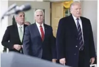  ?? EFE ?? Informe. El presidente Donald J. Trump, acompañado de Mike Pence y Kevin McCarthy, se dirige hacia una conferenci­a de prensa en la Casa Blanca, ayer.