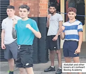  ??  ?? Abdullah and other boxers at Lionheart Boxing Academy