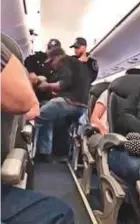  ?? Source: YouTube ?? A series of video grabs posted online by other passengers shows a man, who appeared to be Asian, being dragged down the aisle on United Flight 3411 before it departed from Chicago O’Hare Internatio­nal Airport to Louisville, Kentucky.
