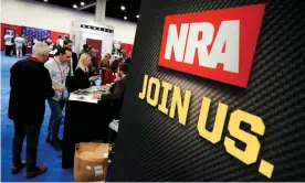  ?? Photograph: Joshua Roberts/Reuters ?? Attendees sign up at the NRA booth at the Conservati­ve Political Action Conference in Oxon Hill, Maryland, in February 2020.