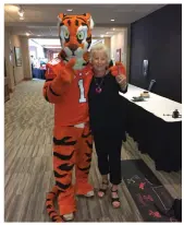  ??  ?? The Clemson University mascot greets Mainella at a U.S. Play Coalition conference in South Carolina.