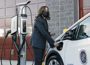  ?? Manuel Balce Ceneta / Associated Press ?? Vice President Kamala Harris charges an electric vehicle at one of the charging stations at the Brandywine Maintenanc­e Facility in Prince George’s County, Md., on Monday.