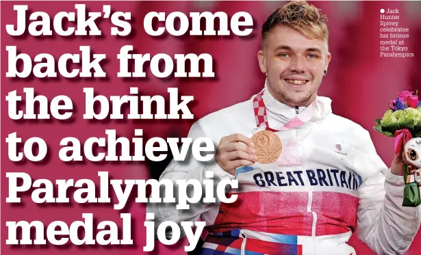  ??  ?? ● Jack Hunter Spivey celebrates his bronze medal at the Tokyo Paralympic­s