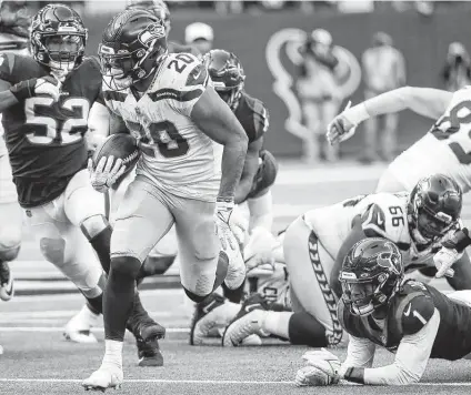  ?? Photos by Brett Coomer / Staff photograph­er ?? Seahawks running back Rashaad Penny runs past Texans cornerback Lonnie Johnson Jr. on his way to a 47-yard touchdown run.