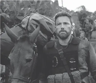  ?? NETFLIX ?? Ben Affleck appears comfortabl­y middle-aged in director J.C. Chandor’s action drama Triple Frontier.