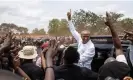  ?? Meinhardt/AFP/Getty Images ?? Moïse Katumbi greets supporters after voting on Wednesday. Photograph: Patrick