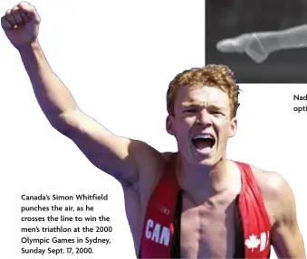  ?? JOHN GILES, CANADIAN PRESS ?? Canada’s Simon Whitfield punches the air, as he crosses the line to win the men’s triathlon at the 2000 Olympic Games in Sydney, Sunday Sept. 17, 2000.