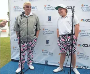  ?? AP ?? John Daly, left, and his son, Little John Daly, talk with reporters after completing the first round of the Father Son Challenge on Saturday in Orlando, Fla.