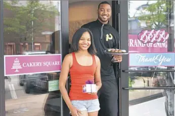  ?? Stephanie Strasburg/Post-Gazette photos ?? Business partners Amber Greene and Wes Lyons will hold the grand opening of their Cakery Square Saturday in The Waterfront shopping center in Homestead.