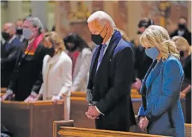  ?? AP PHOTO/EVAN VUCCI ?? Then-President-elect Joe Biden and his wife, Jill Biden, attend Mass at the Cathedral of St. Matthew the Apostle during Inaugurati­on Day ceremonies in Washington on Jan. 20.