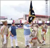  ?? PIC/PTI ?? Home Minister Amit Shah presents the President’s Colours to Assam Police, at Nehru Stadium in Guwahati. Assam Chief Minister Himanta Biswa Sarma is also seen