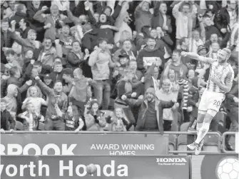  ?? THE ASSOCIATED PRESS ?? Huddersfie­ld’s Laurent Depoitre celebrates scoring against Manchester United.