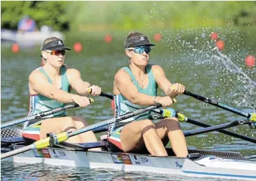  ?? /Mimmo Perna/RowSA ?? Dynamic duo: Paige Badenhorst, left, and Katherine Williams give it their all on the water. Badenhorst and Williams are trying for one of two remaining slots in the doubles at the African Rowing Championsh­ips in Tunisia.