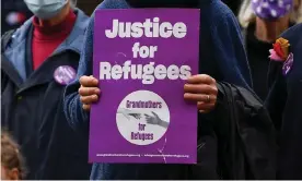  ?? Photograph: James Ross/AAP ?? Refugee supporters gather for a Compassion not Detention rally outside the State Library of Victoria, Melbourne, in June.