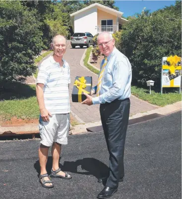  ?? Picture: JUSTIN BRIERTY ?? HISTORY REPEATS: Owner Frank Brace with Ray White Cairns Beaches agent Paul Stirling who sold 1 Dove Court to the Brace family in 1990 and has now sold it again, 28 years later.