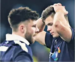  ??  ?? Agony: Huw Jones (right) shows his dejection after Scotland’s drubbing by England
