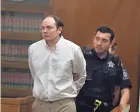  ?? RICK WOOD/MILWAUKEE JOURNAL SENTINEL ?? Jordan Fricke, charged with killing Milwaukee Police Officer Matthew Rittner, is escorted into court before opening remarks Tuesday.