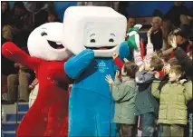  ?? (File Photo/AP/Amy Sancetta) ?? Children attending the short track skating races in the Palavela Arena cheer Feb. 15, 2006, with Torino Olympic mascots Neve (left) and Gliz at the 2006 Winter Olympics in Turin, Italy.