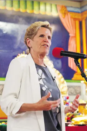  ?? COLE BURSTON/THE CANADIAN PRESS ?? Ontario Liberal Party leader Kathleen Wynne speaks during a campaign stop at the Sri Ayyappan Hindu Temple in Scarboroug­h on Sunday.