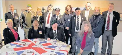  ??  ?? Members of Veterans In Communitie­s at the launch of the art exhibition at Haworth Art Gallery