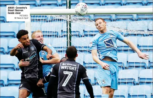  ?? PICTURES: MI News & Sport ?? AWAY: Coventry’s Stuart Beavon heads clear