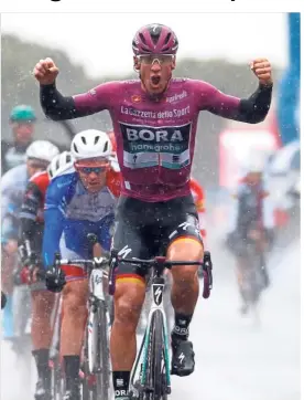  ??  ?? Going all out: Pascal Ackermann celebratin­g as he crosses the finish line in the fifth stage of the Giro d’Italia in Terracina on Wednesday. — AFP