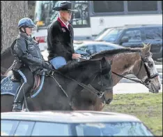  ?? VINCE BURKE / DEPARTMENT OF INTERIOR ?? Interior Secretary Ryan Zinke rides a horse named Tonto to his first day of work in Washington with a mounted police escort.