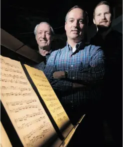  ?? Wayne Cuddington/ Postmedia News ?? Jack McGowan, centre, with his music stand lighting system, which was designed by Scott Gibson, left, and Mark Boycott.