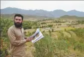  ?? FAROOQ NAEEM / AFP ?? Pervaiz Manan, head of the Khyber Pakhtunkhw­a forest department, looks on during an interview in a tree plantation in Heroshah district in northwest Pakistan, on May 17.