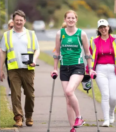  ??  ?? Sinead MacErlane and her supporters on her 5km sponsored crutch run.