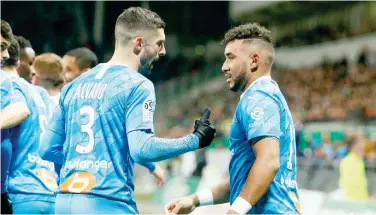  ?? Reuters ?? ↑
Marseille’s Dimitri Payet (right) celebrates after scoring against Saint-etienne during their French League match at the Stade Geoffroy-guichard in Saint-etienne on Wednesday.